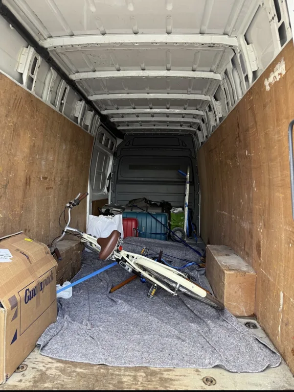 Moving trolley, protective blankets and equipment in a van